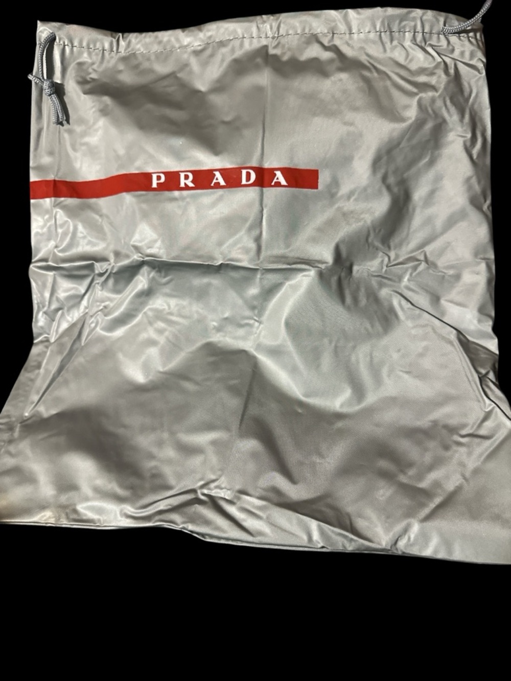 Prada Silver Dust Bag with Red Logo